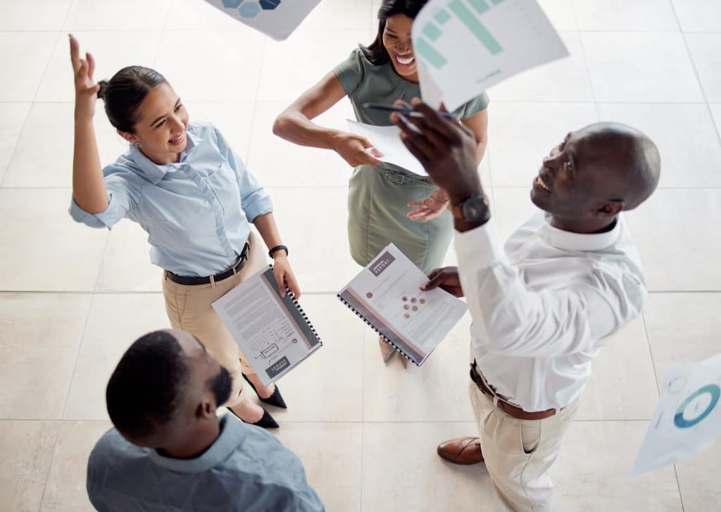 South African coworkers discussing work pressures and practical ways to manage stress.
